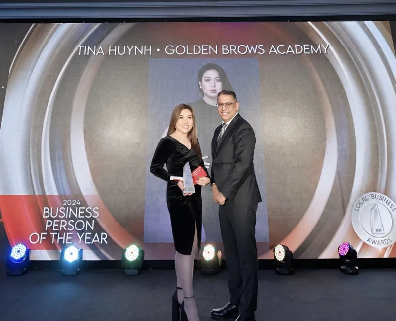 Tina receiving her award on stage