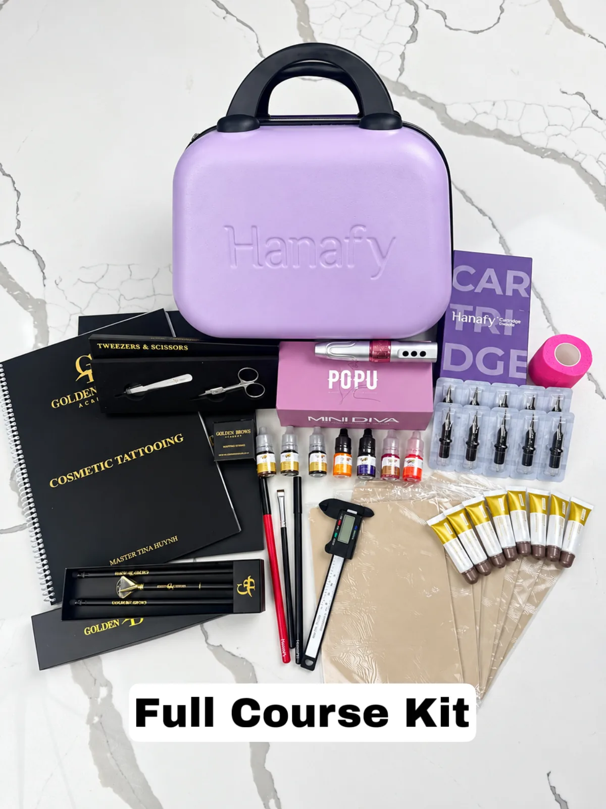The Full Course kit laid out: the Hanafy case, machine, pigments, needles and tools