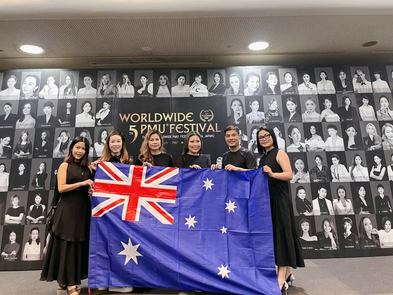 Tina with the Australian flag at the Worldwide PMU Festival in Japan